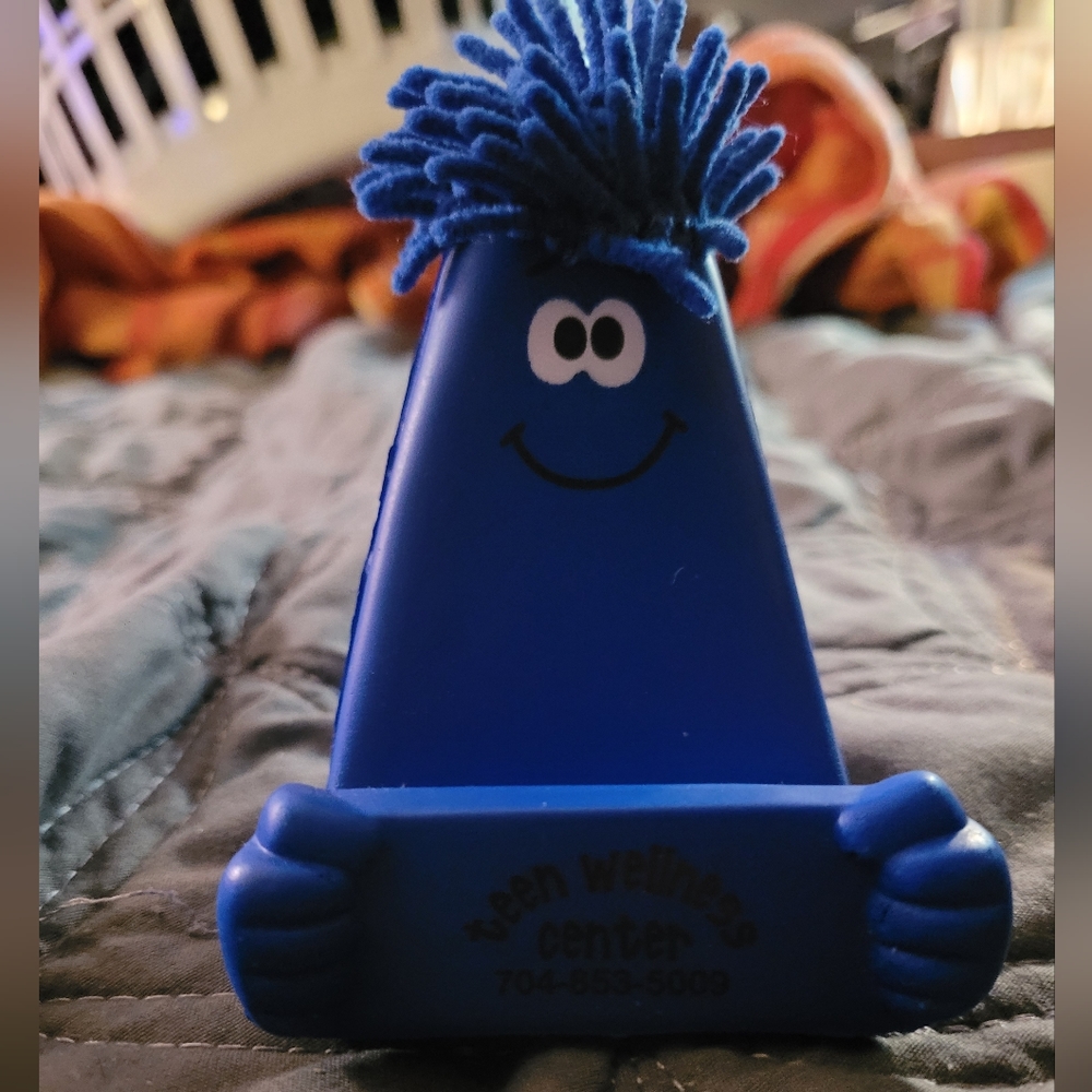 Squishy phone holder with phone duster